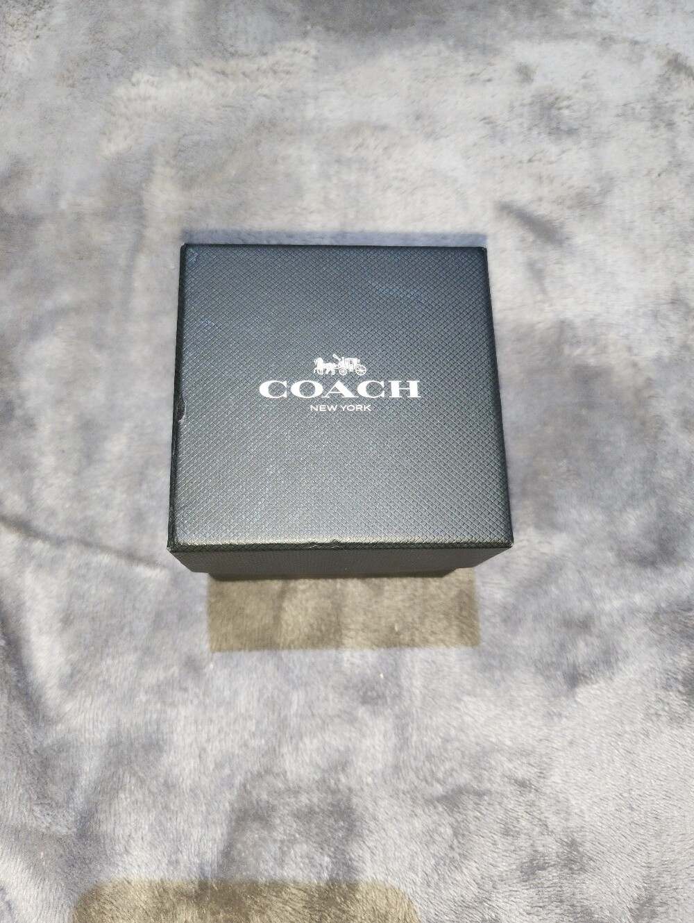 Coach luxury timepiece presentation box.